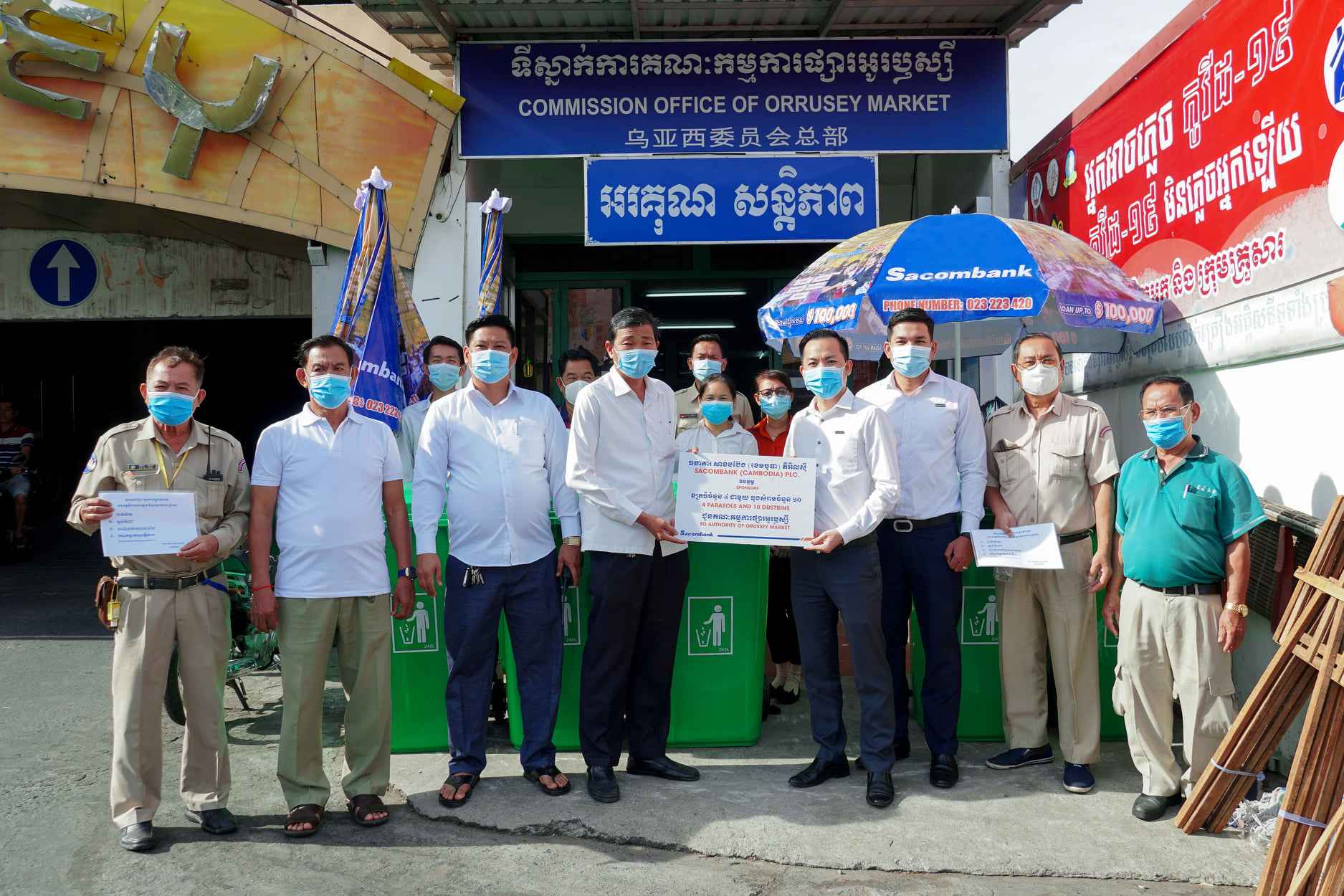 Sacombank Cambodia sponsored umbrellas and dustbins to Orussey Market Commission